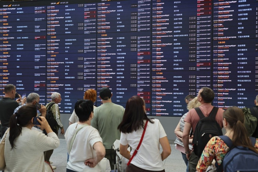 Passengers waiting for their flights at Sheremetyevo International Airport outside Moscow amid major flight disruptions on 7 July 2025. Photo: EPA/YURI KOCHETKOV