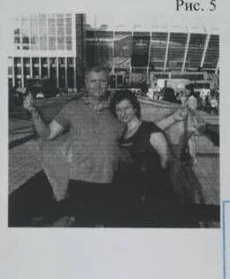 Gennady and Olga in Kyiv, holding a Ukrainian flag. Photo from personal archive, used as case material