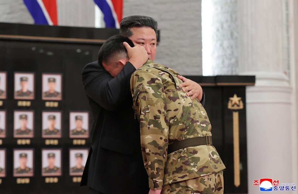 Kim Jong Un comforts a North Korean soldier in a ceremony honouring soldiers serving in overseas operations held in Pyongyang, North Korea. Photo: EPA/KCNA