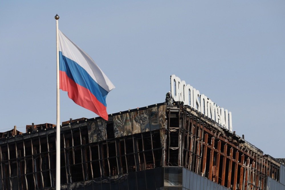 A Russian flag flutters over Crocus City Hall, 21 March 2025. Photo: EPA-EFE/MAXIM SHIPENKOV