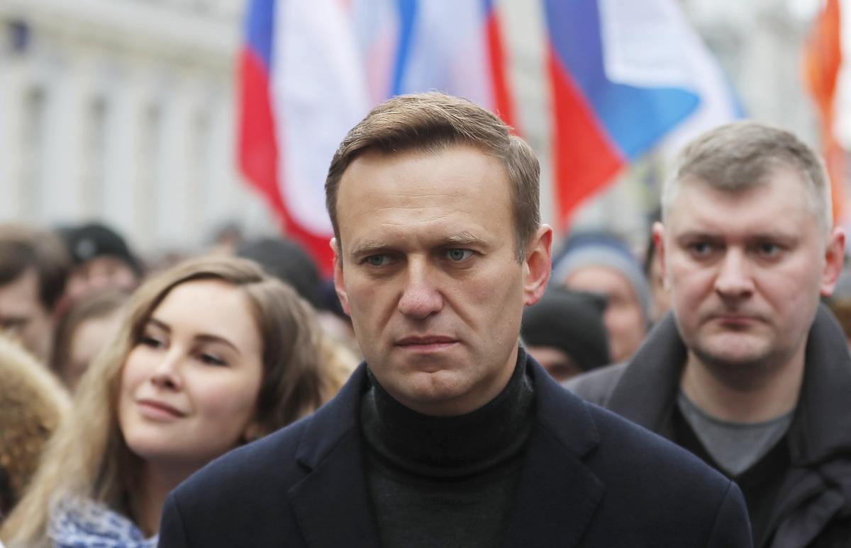 Alexey Navalny takes part in a memorial march in Moscow for opposition politician Boris Nemtsov, marking the fifth anniversary of his assassination. 29 February 2020. Photo: EPA / YURI KOCHETKOV